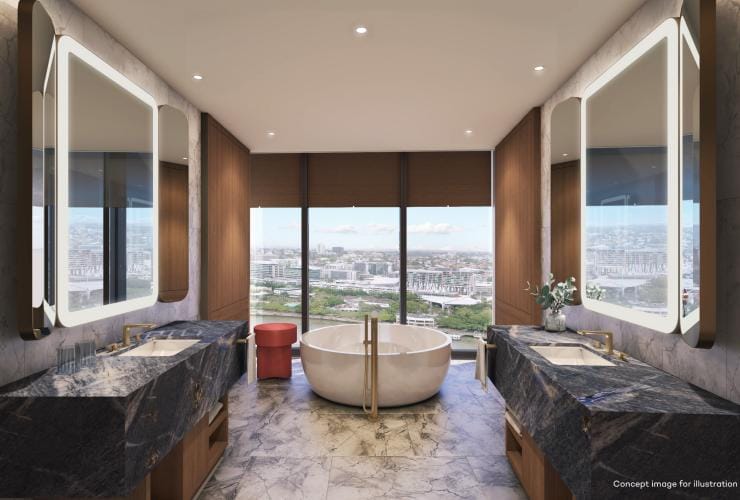 A marble bathroom with a freestanding bath beside a floor to ceiling window overlooking a city at the Star Grand, Skyline Penthouse Suite, Brisbane, Queensland © The Star Brisbane