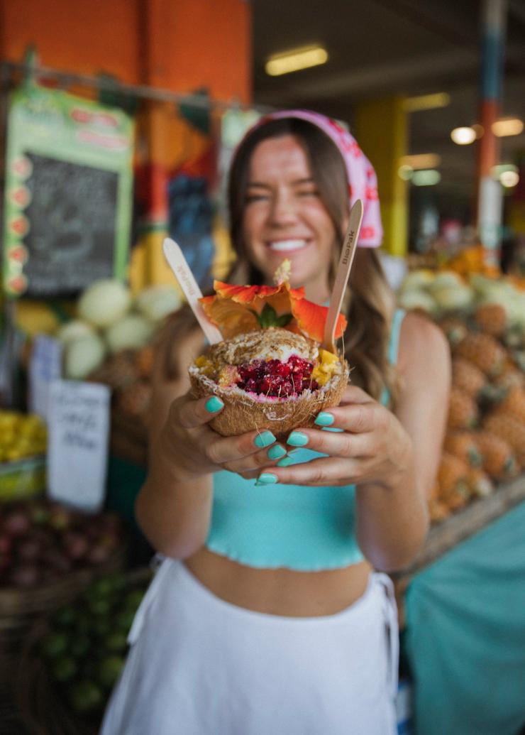 Young woman at The Grateful Coconut at Rusty’s Market in Cairns © Tourism Tropical North Queensland