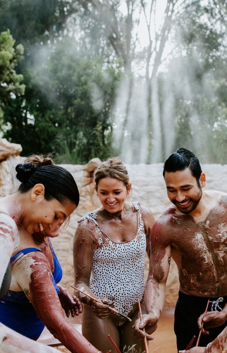 Group of friends participate in a body clay ritual at Peninsula Hot Springs © Peninsula Hot Springs 