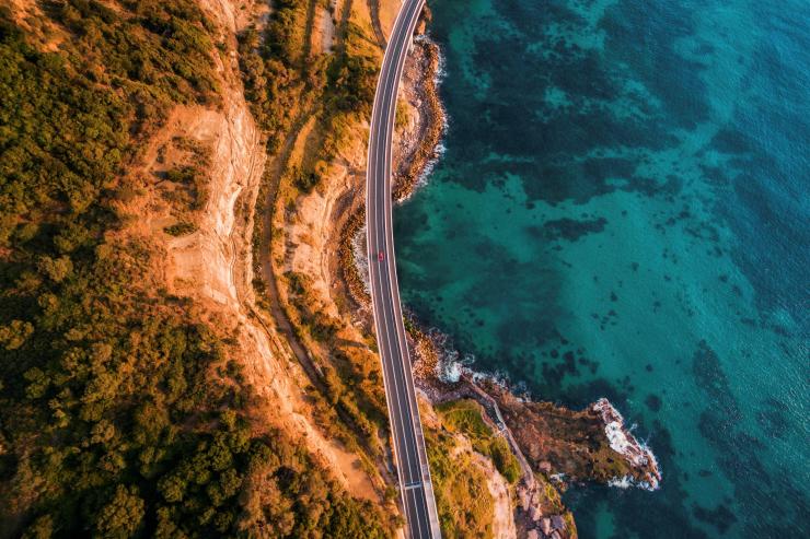 Aerial view of the Sea Cliff Bridge suspended over the ocean in Clifton, New South Wales ©  Destination NSW