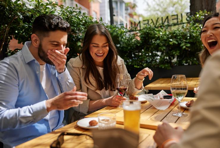 A group of friends laughing as they dine at NOLA, Adelaide, South Australia © South Australian Tourism Commission