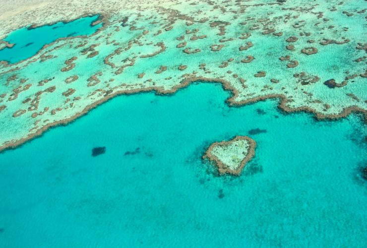 Aerial view over Heart Reef and the surrounding corals of the Great Barrier Reef in the Whitsundays, Queensland © Tourism Whitsundays