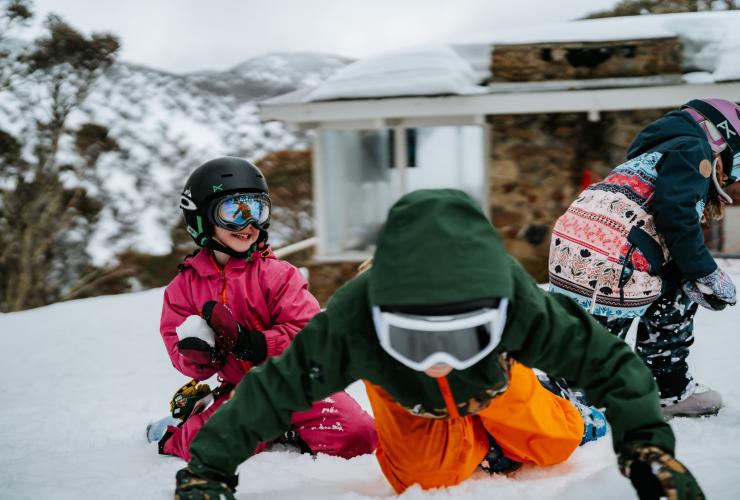 A group of children playing in the snow at Mt Hotham, High Country, Victoria © Tourism North East