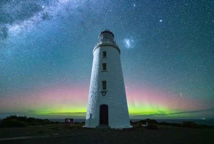 Stars and southern lights behind the Cape Bruny Lighthouse at night on Bruny Island, Tasmania © Luke Tscharke