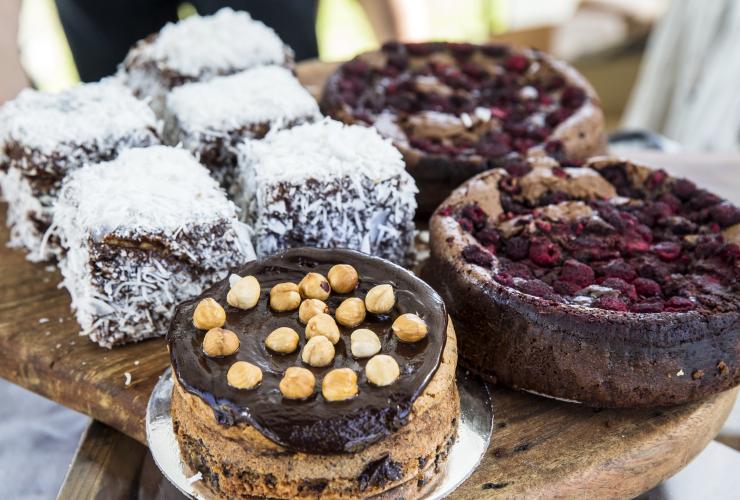 A display of cakes and lamingtons at the Growers' Market Pyrmont, Sydney, New South Wales © Destination NSW / James Horan
