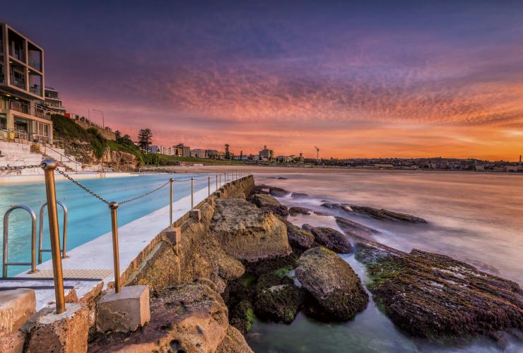 Close up of Bondi Icebergs with the sun setting overhead at Bondi Beach, New South Wales © Destination NSW