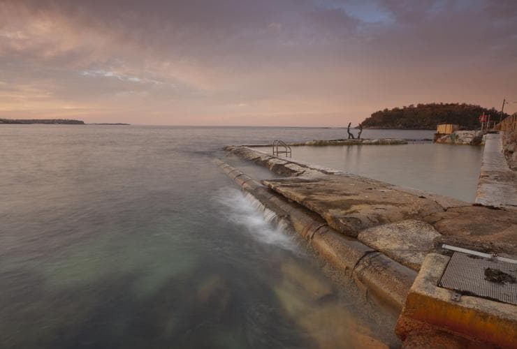 Fairy Bower ocean pool and the surrounding clear ocean on a still evening in Sydney, New South Wales © Andrew Gregory/Destination NSW